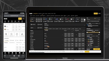 Bwin website open and visible on an iphone xr and a macbook air