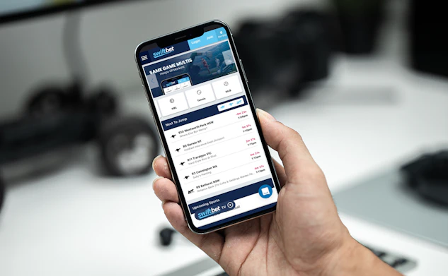 Man using swiftbet on black iphone 12