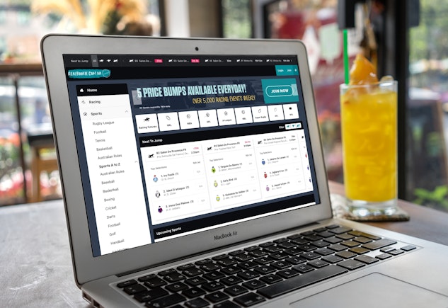 User interacting with Real Bookie betting site on desktop computer